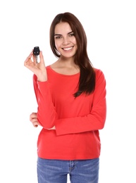 Photo of Happy young woman with car key on white background. Getting driving license