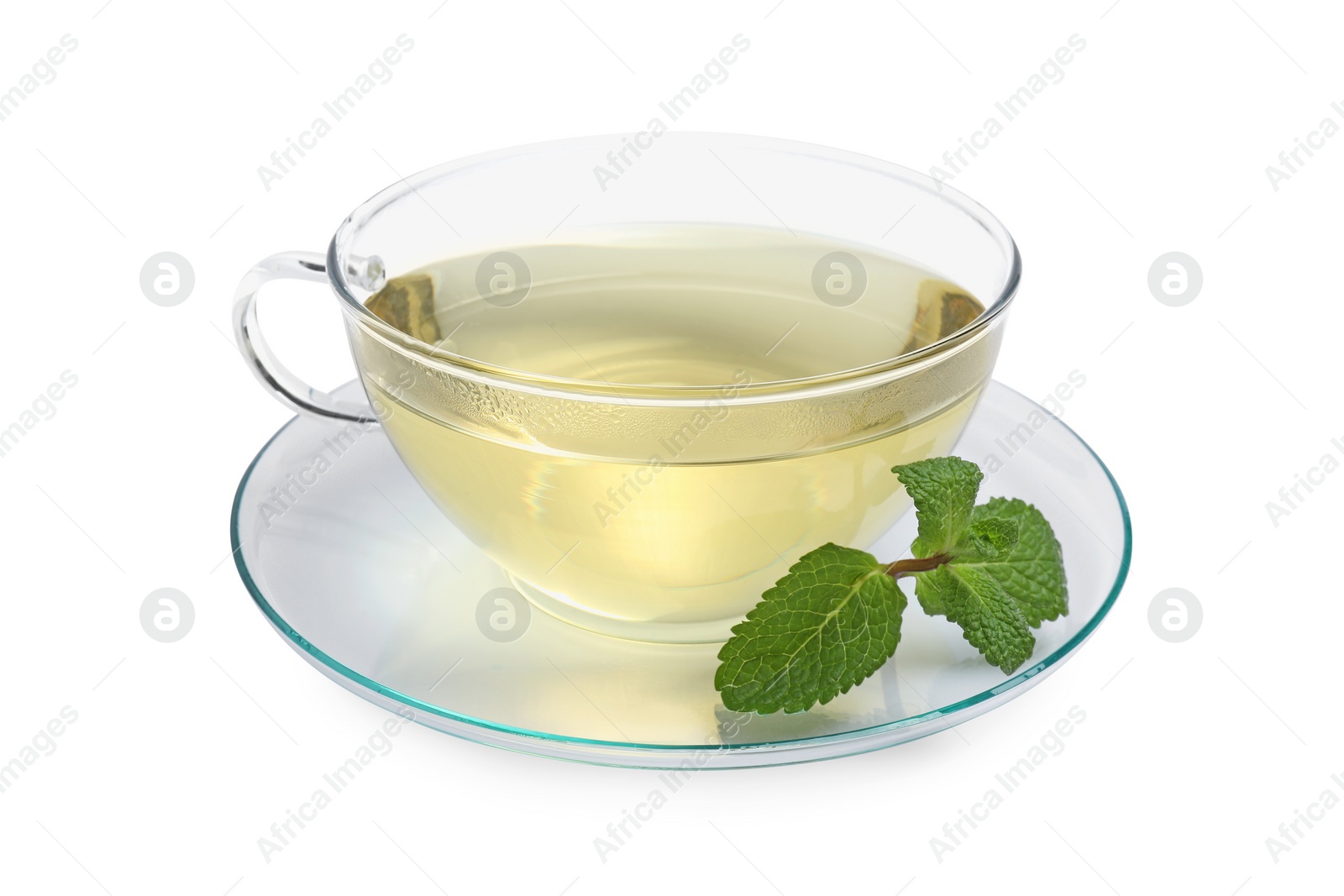 Photo of Refreshing green tea in cup and mint leaves isolated on white