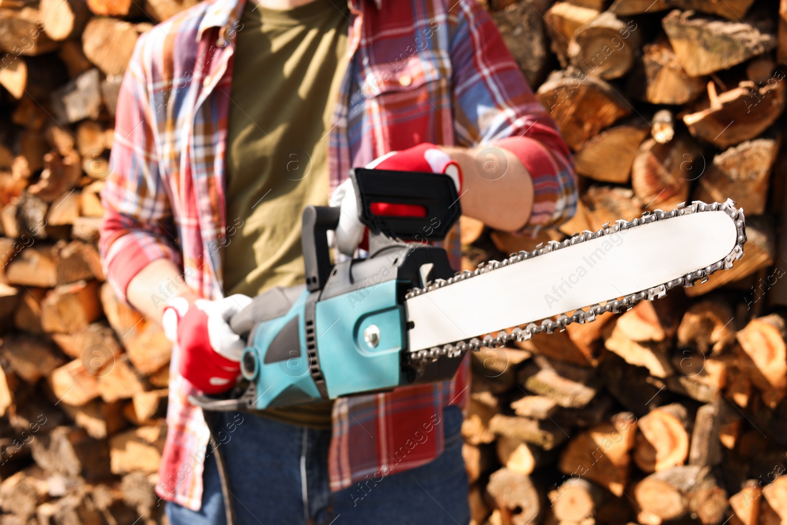 Photo of Man with modern saw on sunny day, closeup