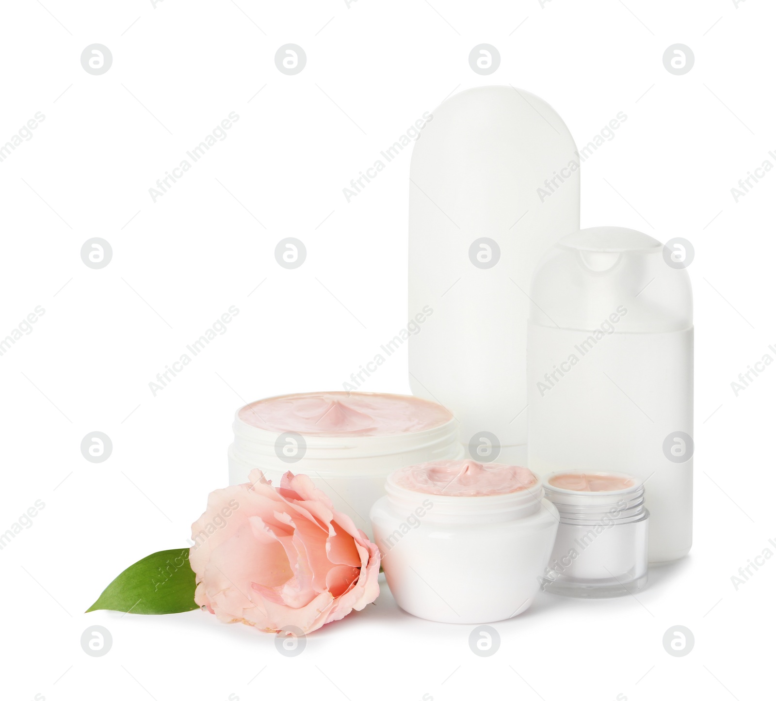 Photo of Jars with cream and bottles on white background. Hand care cosmetics