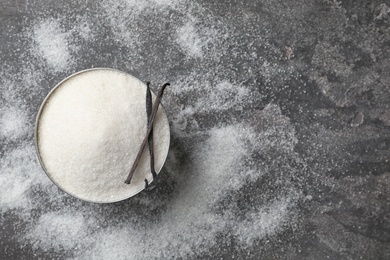 Photo of Bowl with vanilla sugar on grey background, top view