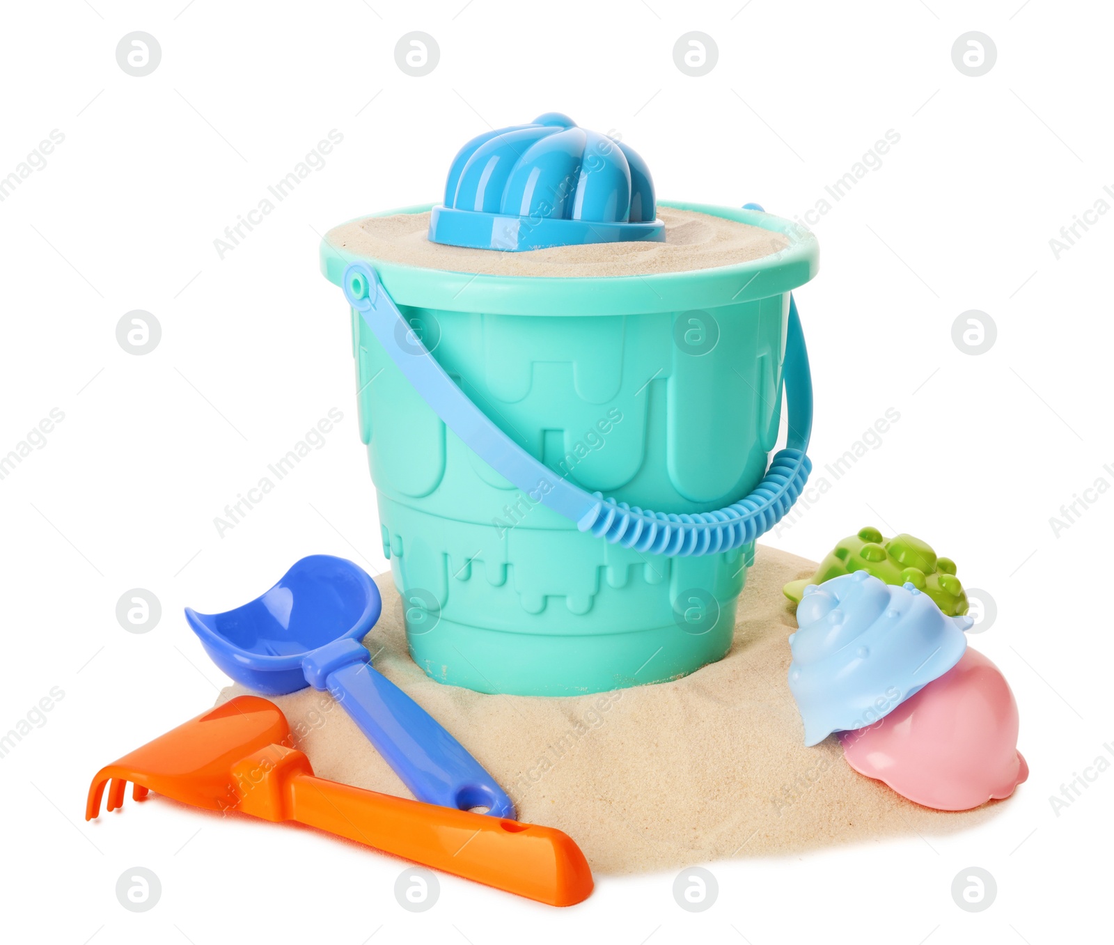 Photo of Plastic beach toys on pile of sand, white background