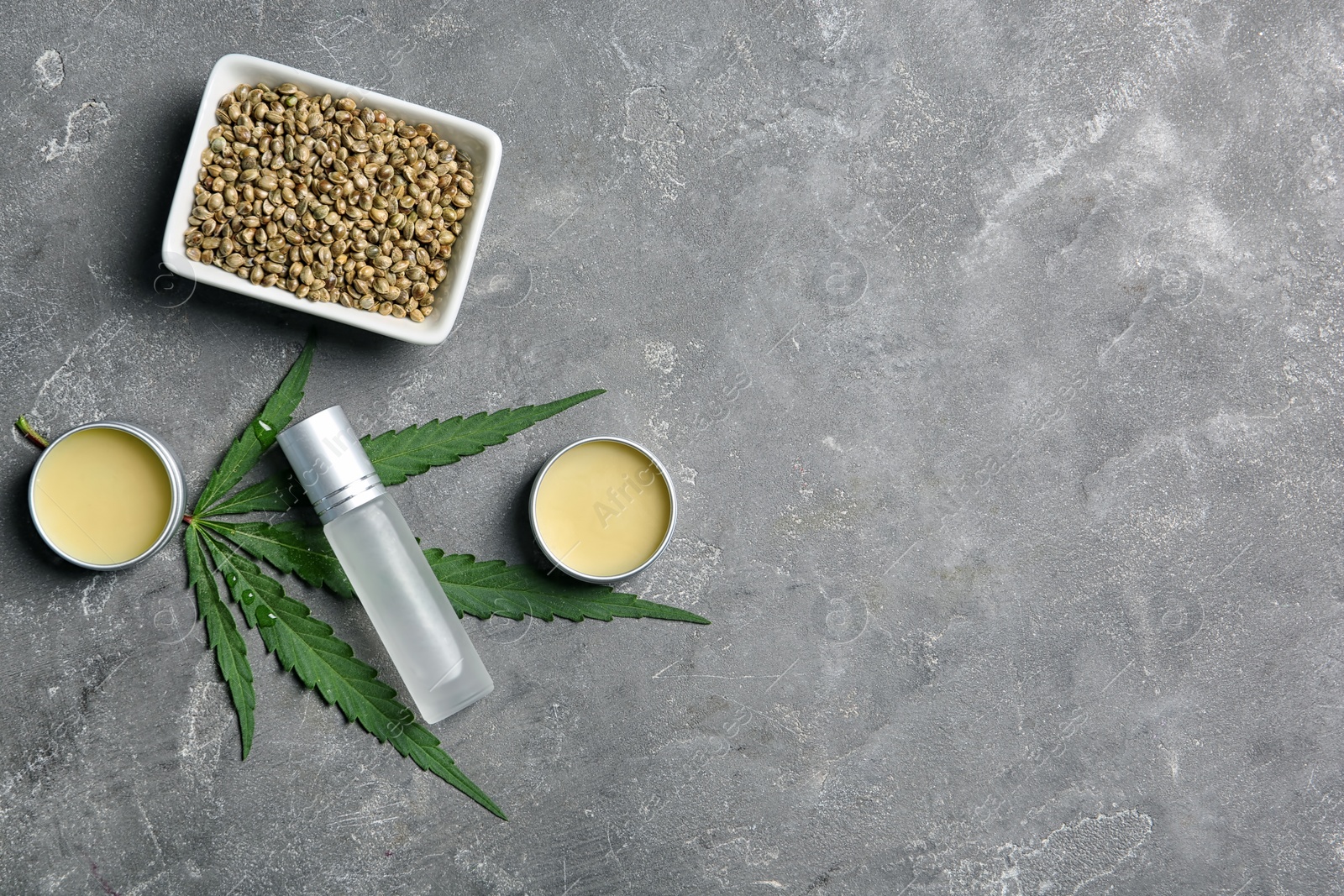 Photo of Flat lay composition with hemp lotion and space for text on grey background