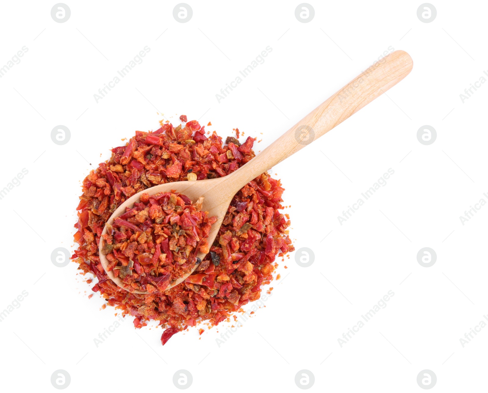 Photo of Aromatic spice. Red chili pepper flakes and spoon isolated on white, top view