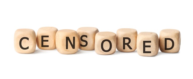 Photo of Wooden cubes with word Censored on white background