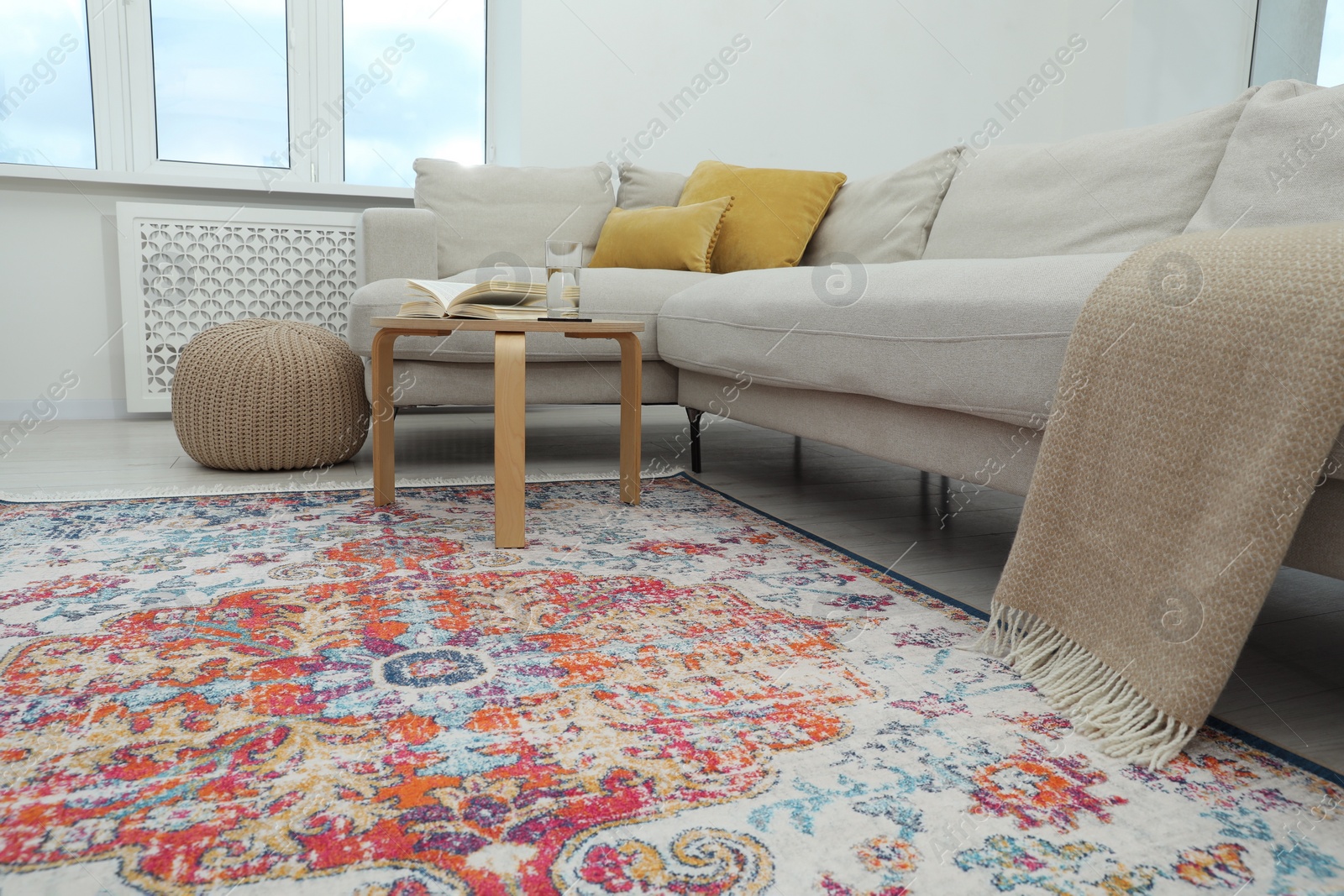 Photo of Stylish living room with beautiful carpet and furniture. Interior design