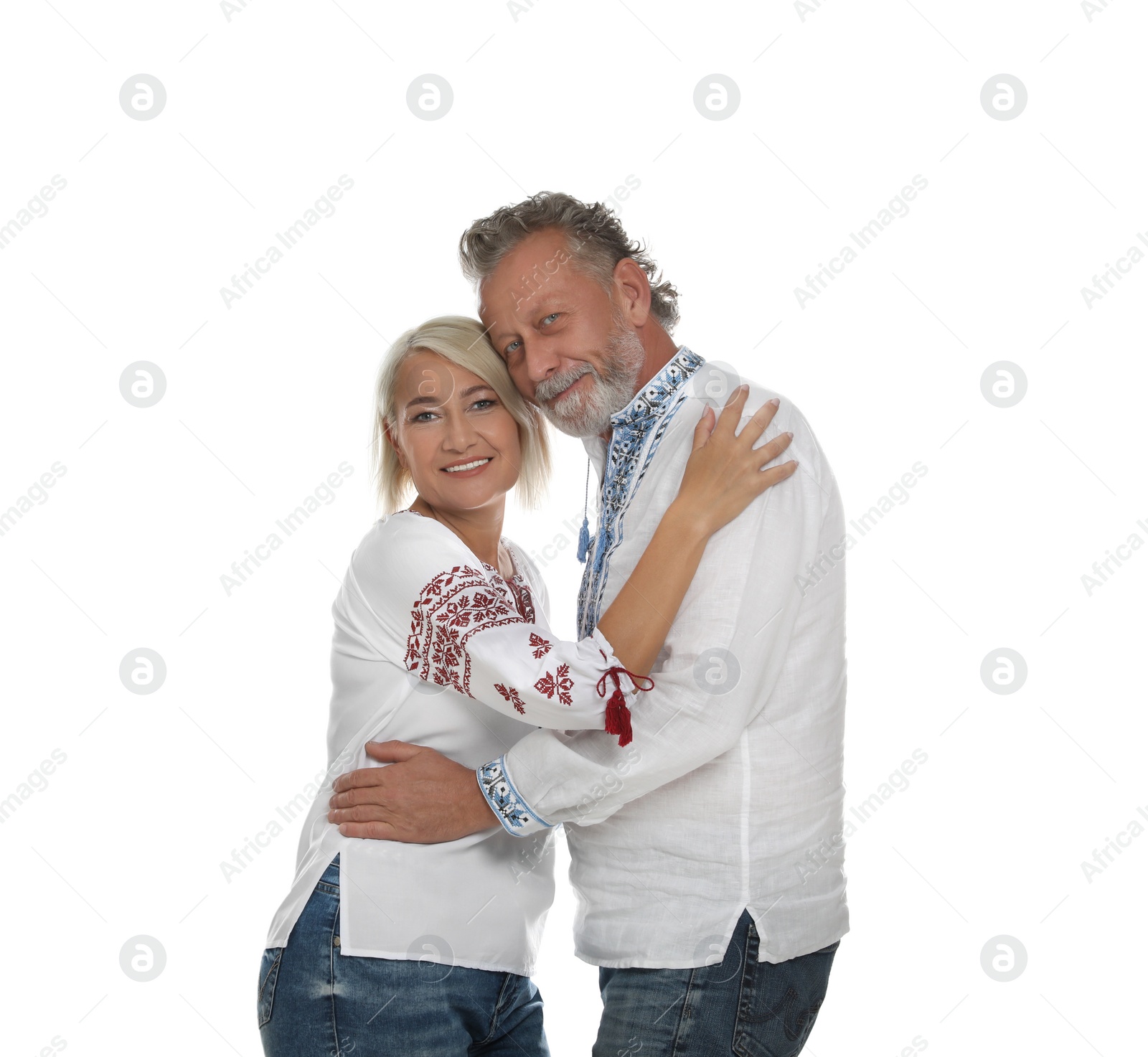 Photo of Happy mature couple in Ukrainian national clothes on white background