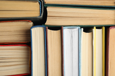 Many different hardcover books as background, top view