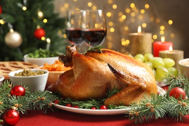 Photo of Traditional festive dinner with delicious roasted turkey served on table