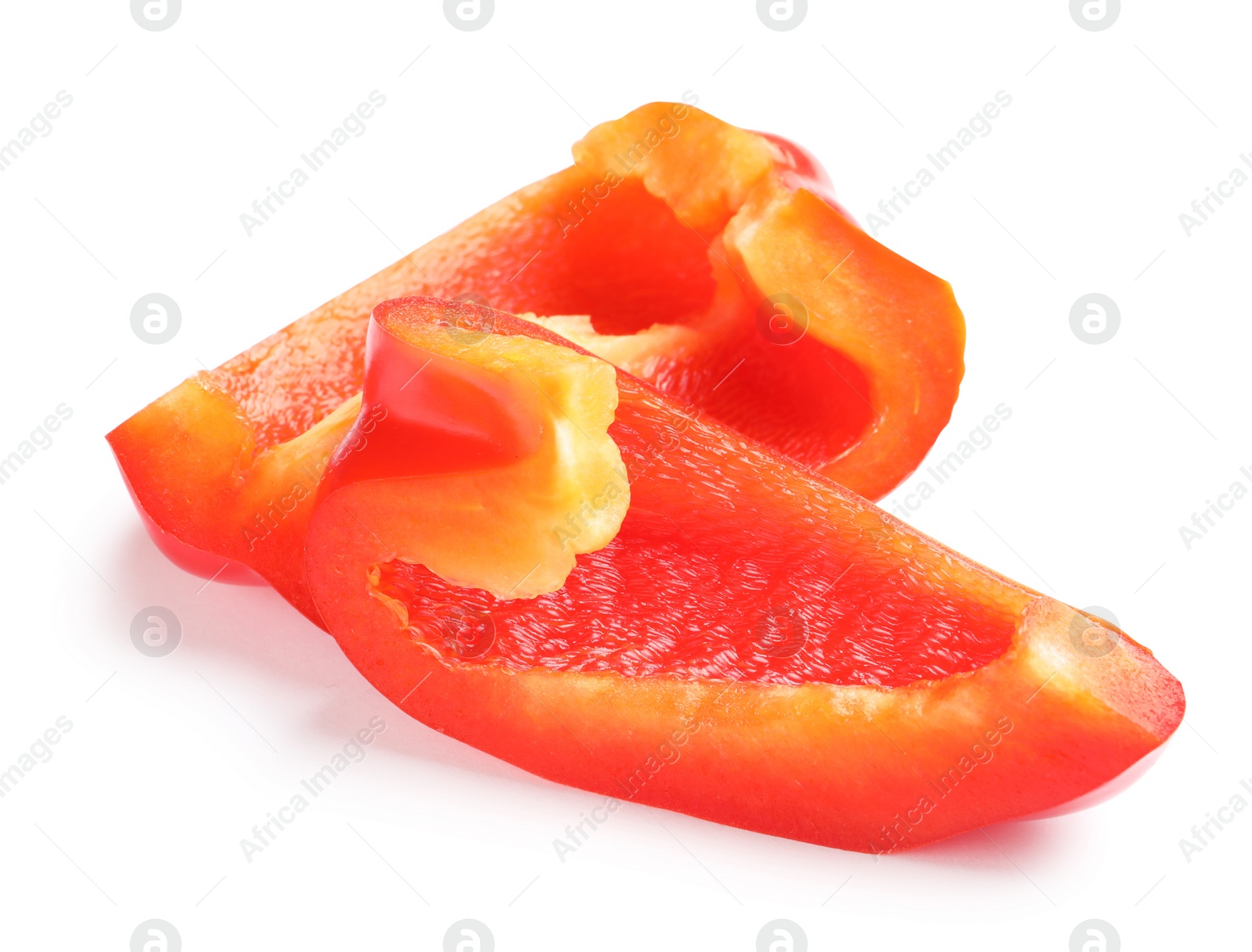 Photo of Slices of ripe red bell pepper on white background