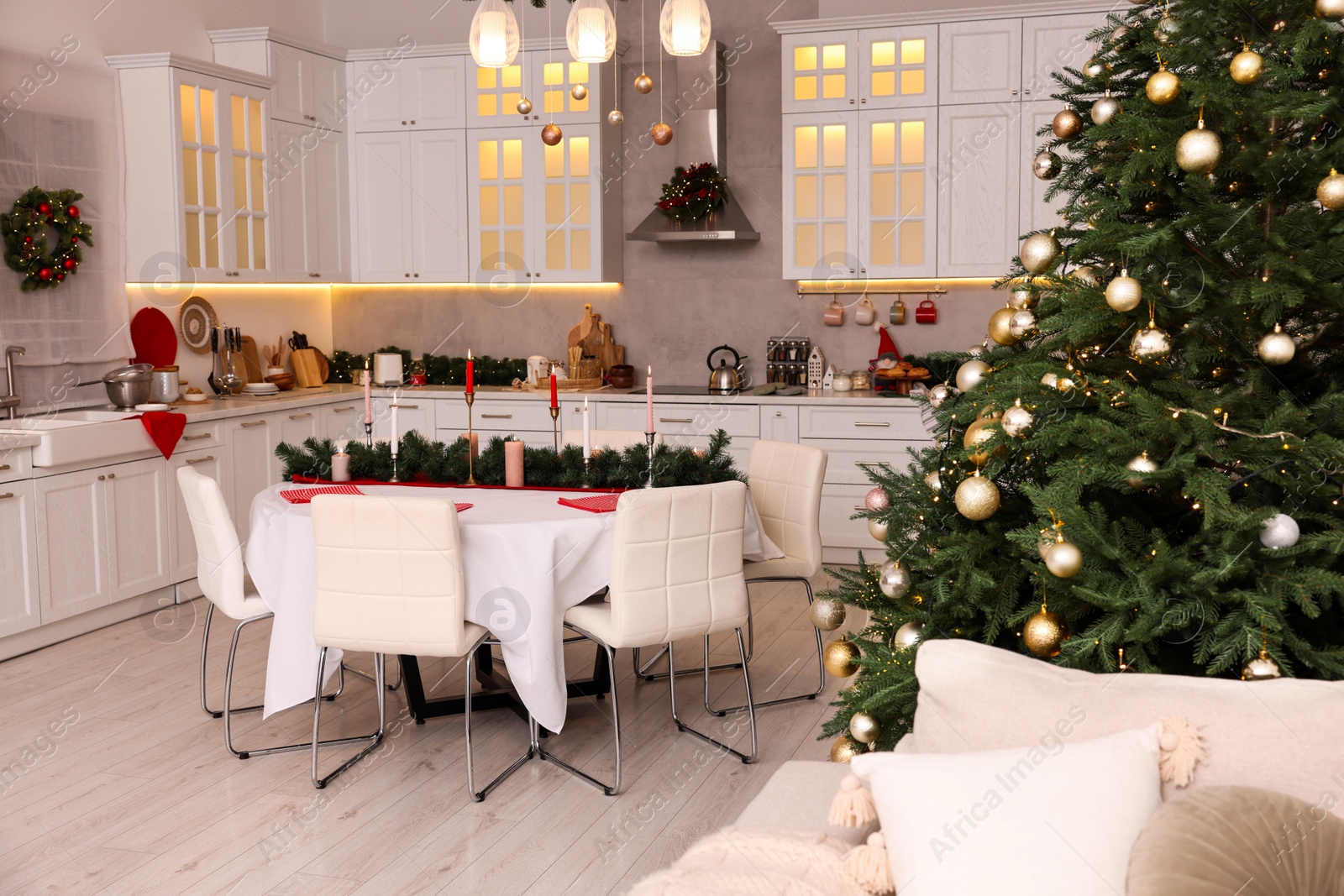 Photo of Cozy spacious kitchen decorated for Christmas. Interior design