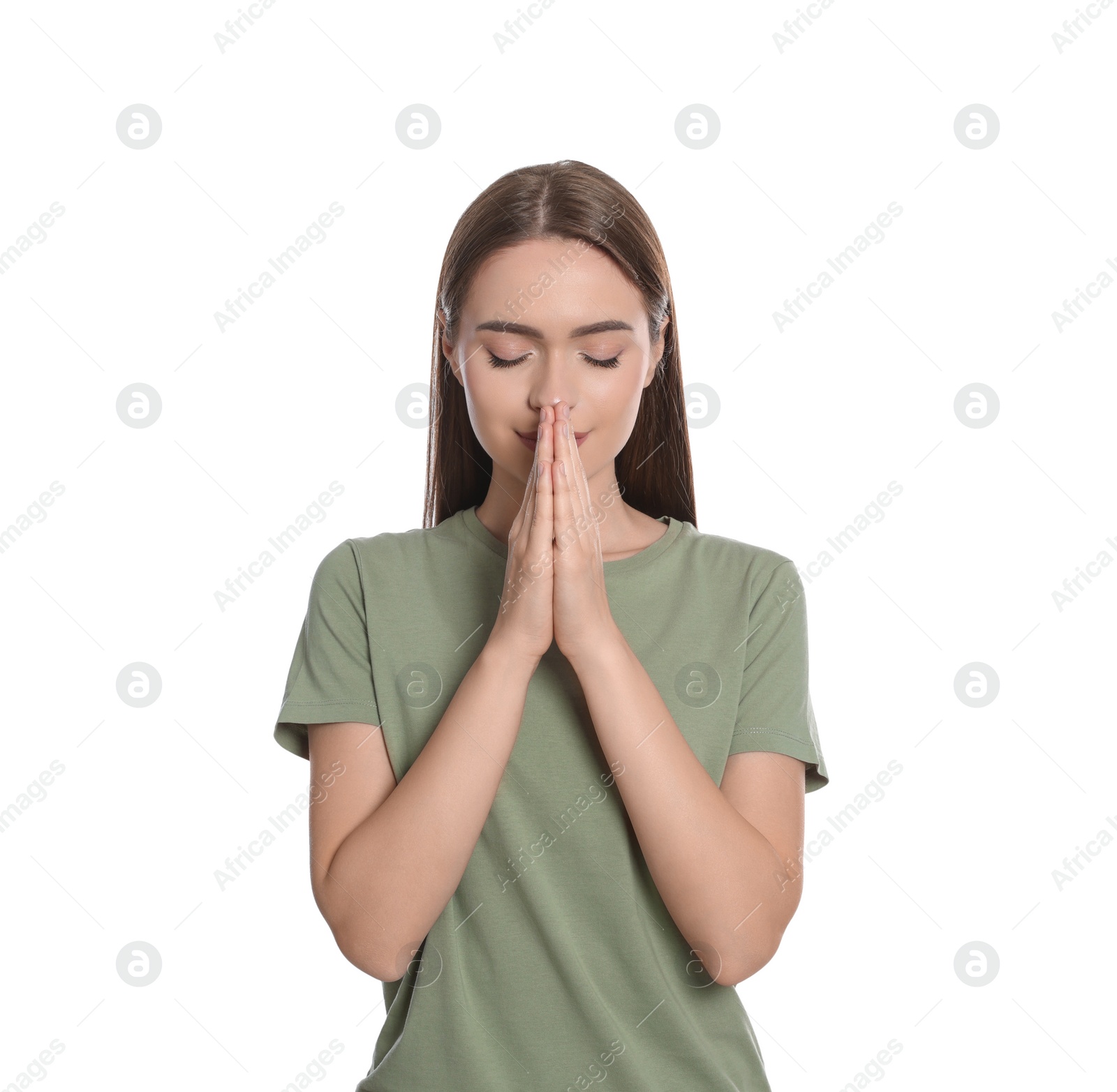 Photo of Woman with clasped hands praying on white background