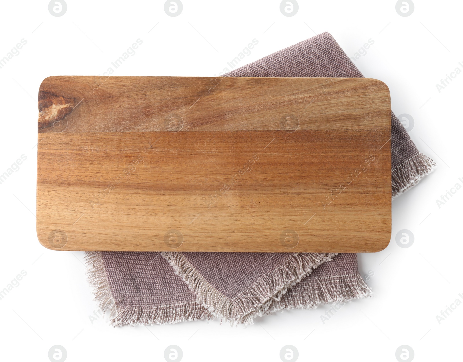 Photo of Wooden cutting board and kitchen towel isolated on white, top view