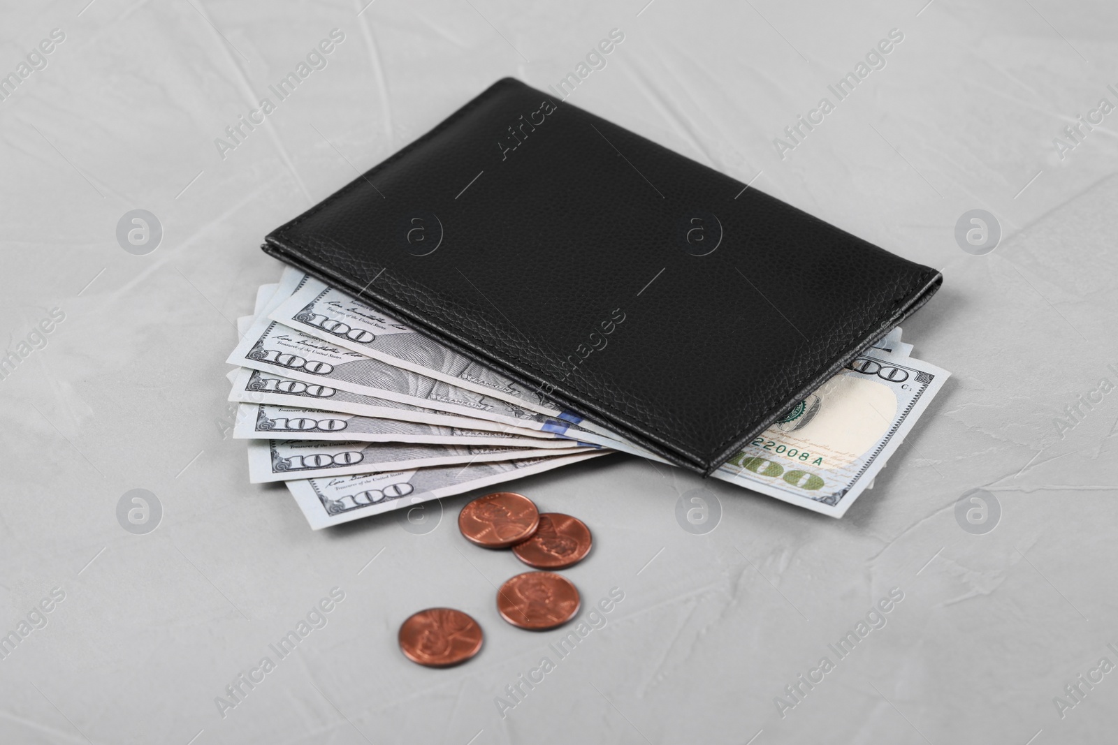 Photo of Pension certificate with American money on grey stone background