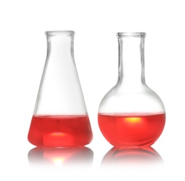 Photo of Florence and conical flasks with liquid samples isolated on white. Chemistry glassware