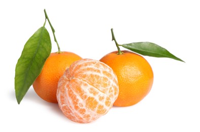 Fresh ripe juicy tangerines with green leaves isolated on white