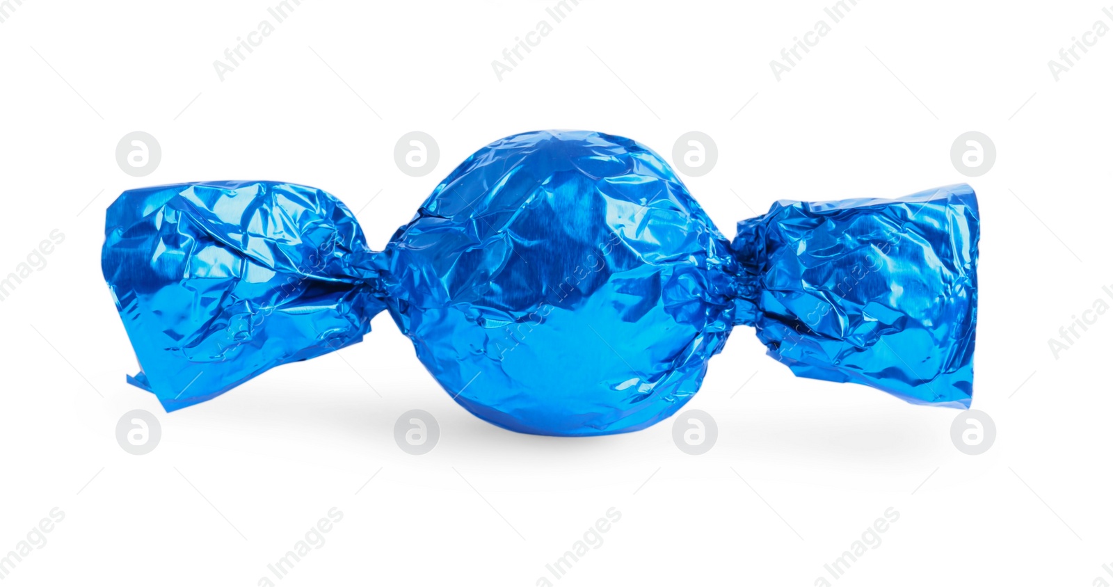 Photo of Tasty candy in blue wrapper isolated on white