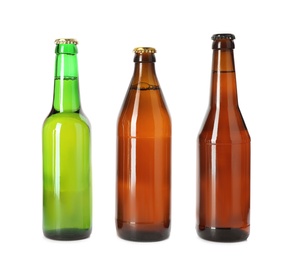 Bottle with different types of beer on white background