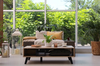 Indoor terrace interior with modern furniture and houseplants