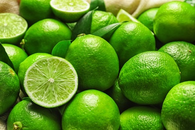 Photo of Fresh ripe green limes, closeup