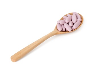 Vitamin pills in wooden spoon isolated on white. Health supplement