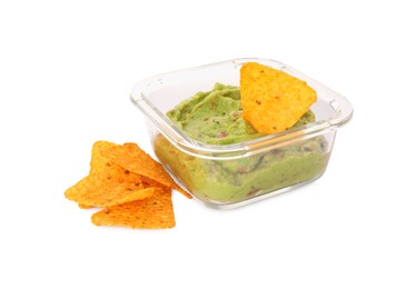 Photo of Bowl of delicious guacamole with nachos chips isolated on white