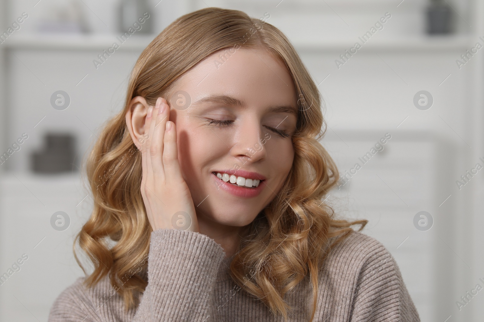 Photo of Portrait of beautiful woman with blonde hair indoors