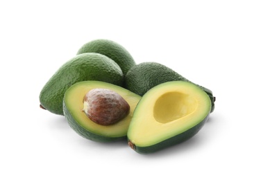 Photo of Ripe avocados on white background. Tropical fruit