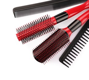 Photo of Set of hair brushes and combs isolated on white, top view