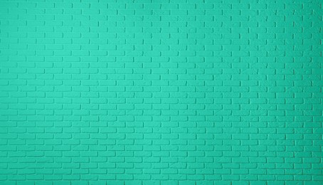 Texture of turquoise color brick wall as background