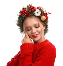 Photo of Beautiful young woman wearing Christmas wreath on white background