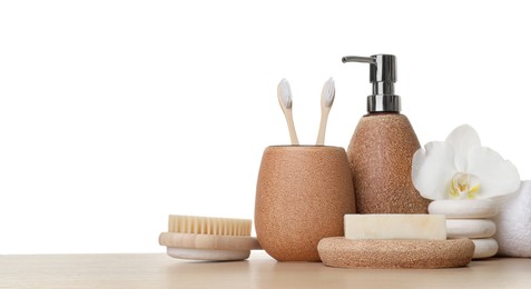 Bath accessories. Different personal care products and flower on wooden table against white background. Space for text