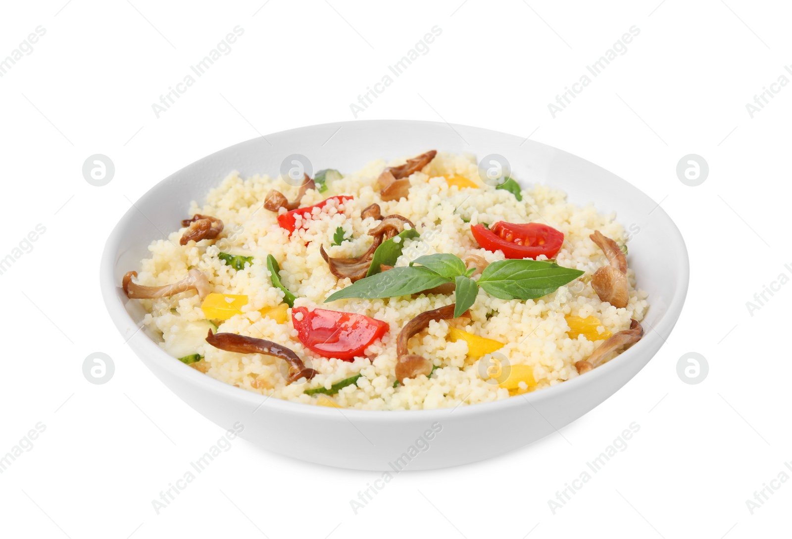 Photo of Bowl of delicious couscous with mushrooms, vegetables and basil isolated on white