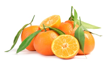 Tasty ripe tangerines with leaves on white background