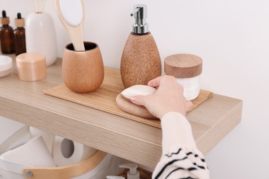 Photo of Bath accessories. Woman with soap indoors, closeup