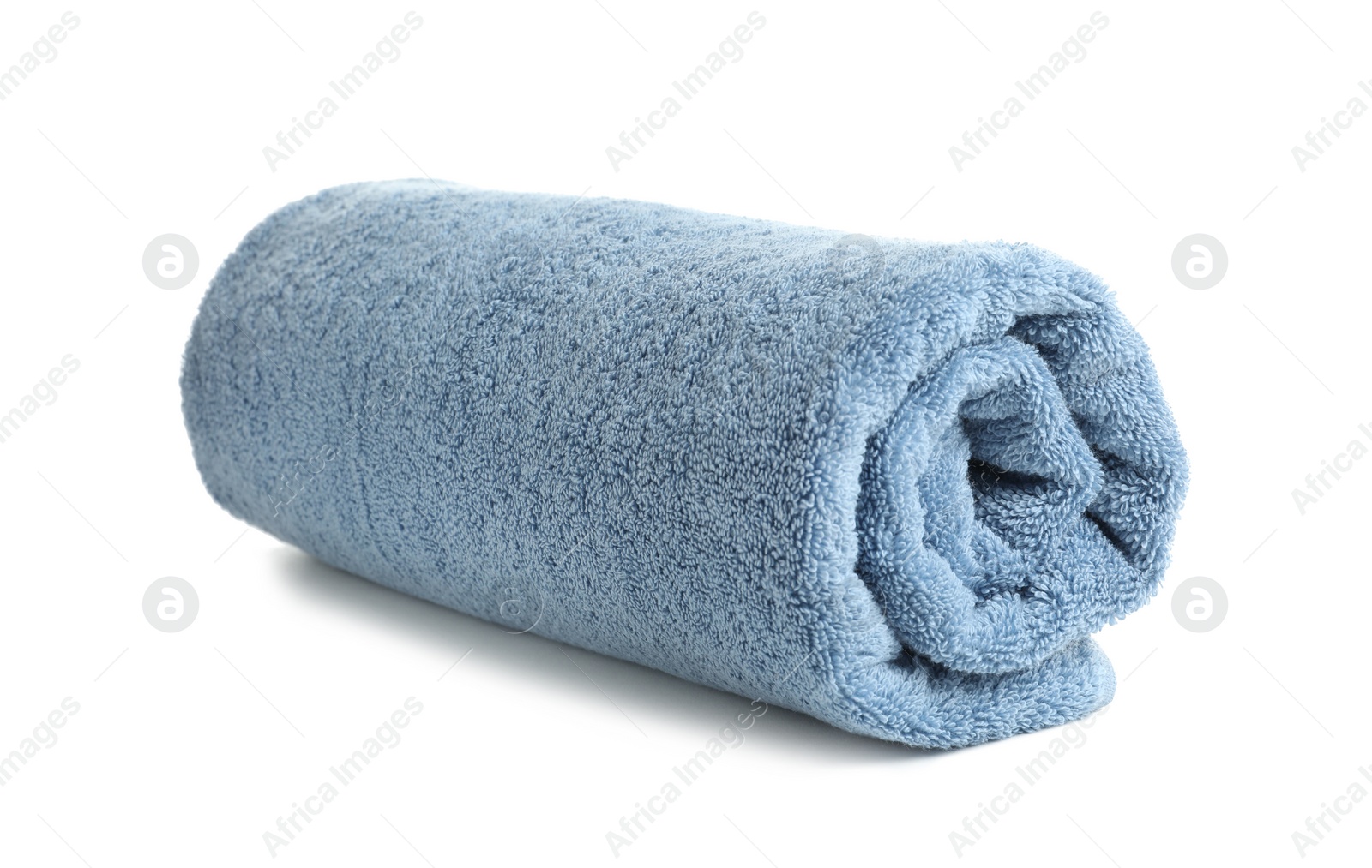 Photo of Rolled soft terry towel on white background