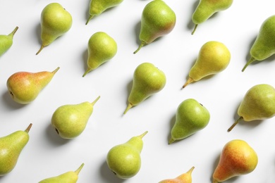 Photo of Ripe juicy pears on white background, top view