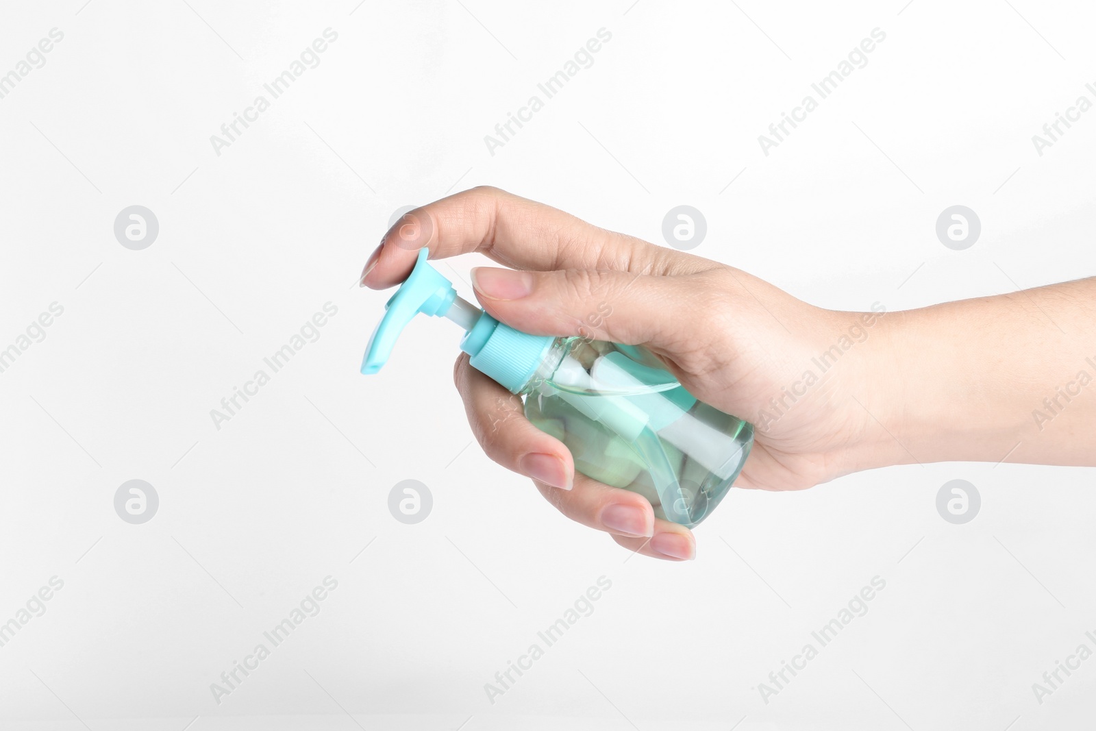 Photo of Woman holding antiseptic gel on white background, closeup