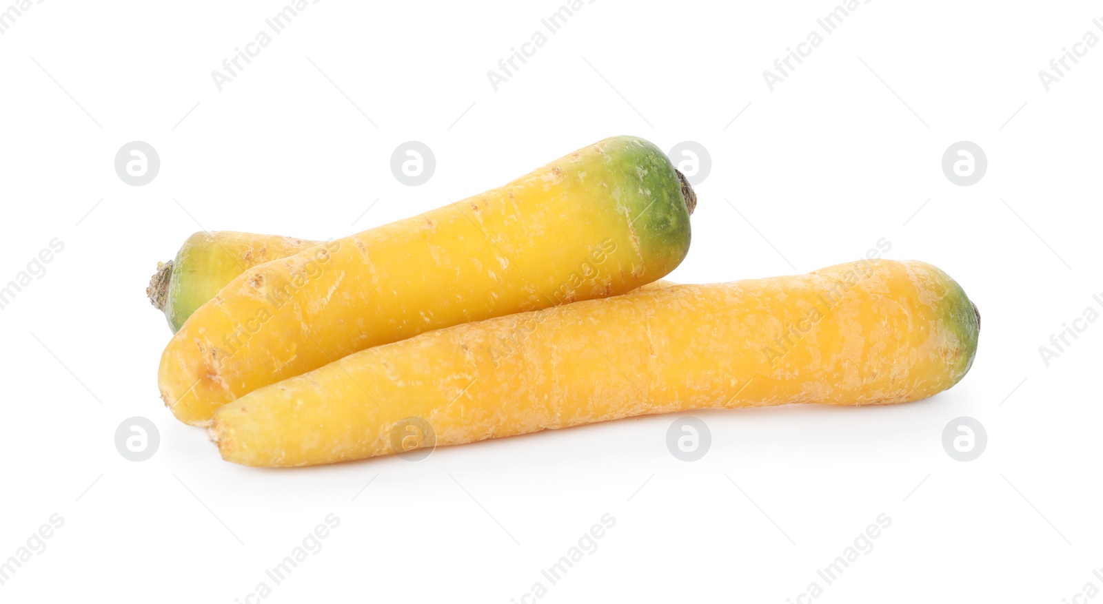 Photo of Fresh raw yellow carrots isolated on white