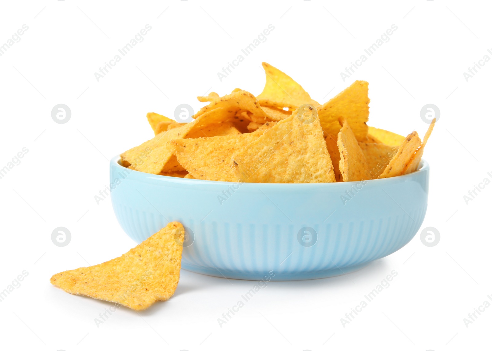 Photo of Ceramic bowl of Mexican nachos chips on white background