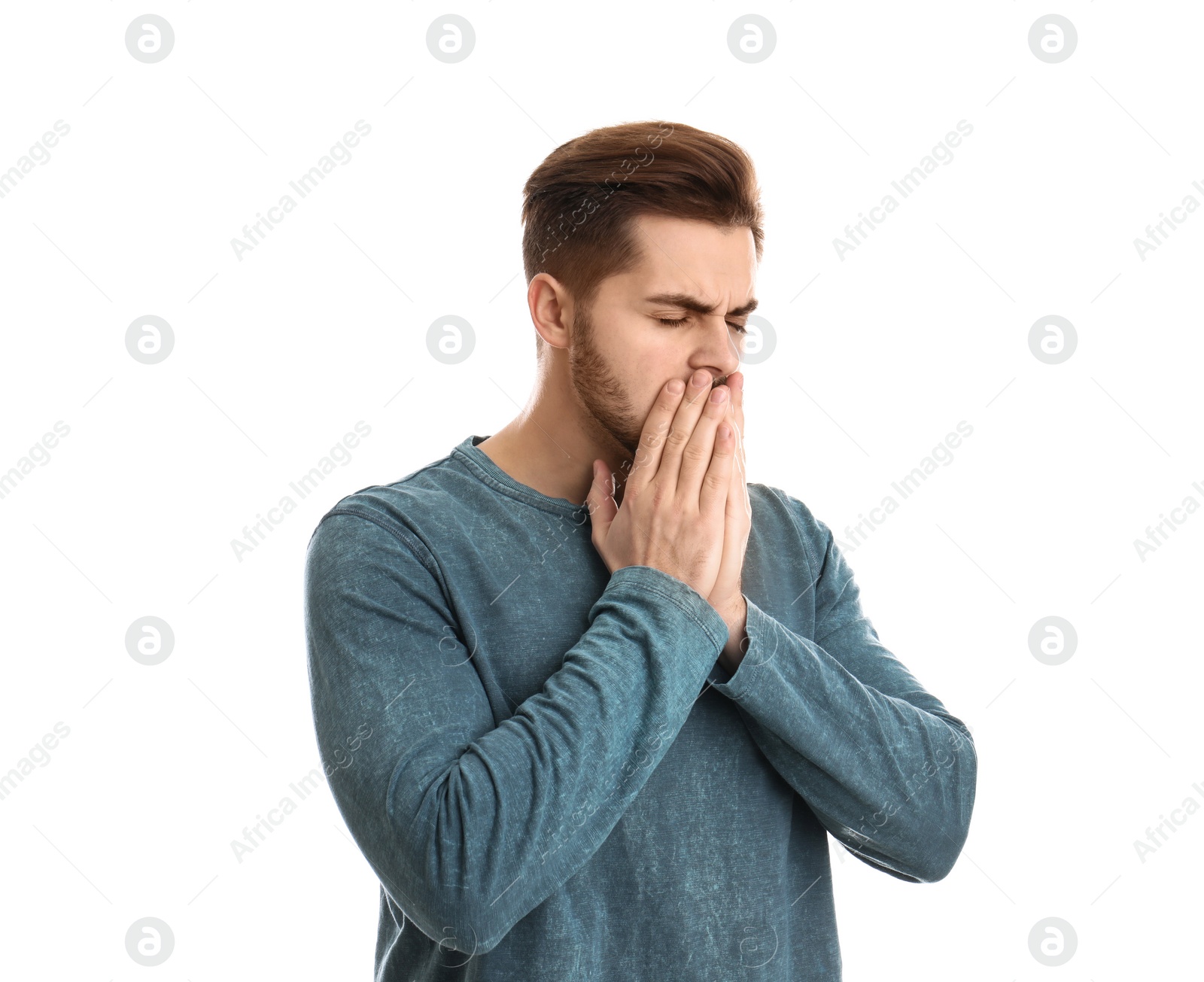 Photo of Handsome young man coughing against white background