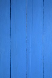 Texture of dark blue wooden surface as background, closeup
