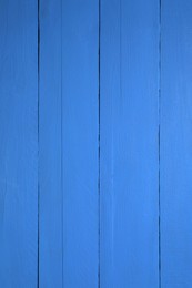 Photo of Texture of dark blue wooden surface as background, closeup