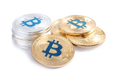 Photo of Pile of bitcoins isolated on white. Digital currency