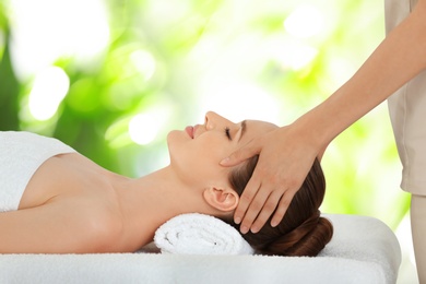 Image of Beautiful young woman enjoying massage. Spa treatment