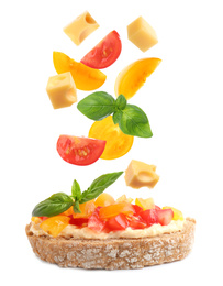 Image of Tasty bruschetta with flying ingredients on white background