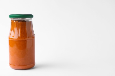 Jar of butternut squash spread on white background. Pickled food