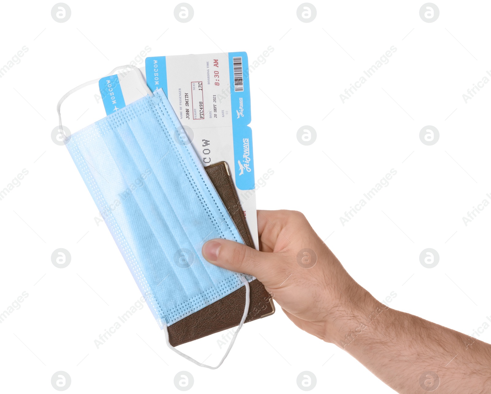 Photo of Man holding passport, tickets and protective mask on white background, closeup. Travel during quarantine