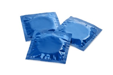 Photo of Packaged condoms on white background. Safe sex