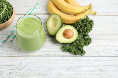 Photo of Tasty fresh kale smoothie on white wooden table